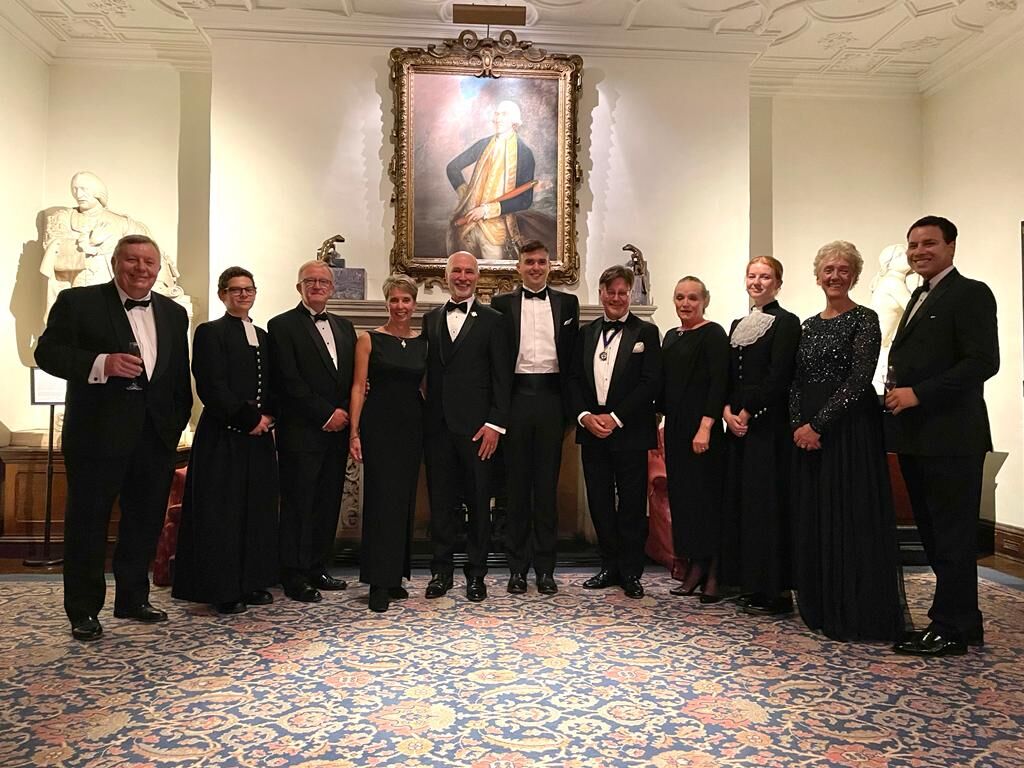 Official group with speakers, Grecians and stewards in the reception room
